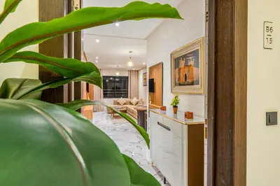 a living room with a large green plant at Moonlight Suite Pool and Relaxation in Marrakech