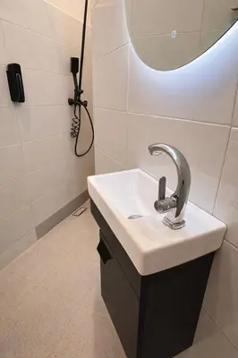 a bathroom with a sink and a mirror at Studio sur guiliz avec piscine et parking in Marrakech