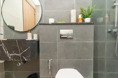 a bathroom with a toilet and a mirror at Home Holiday pool-Guéliz, Marrakech in Marrakech