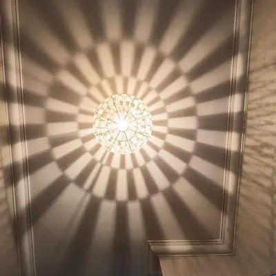 a ceiling with a chandelier in a room at Dolce appartement proche de l'aéroport in Marrakech