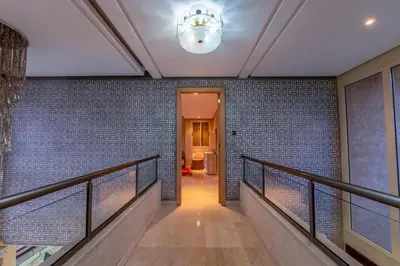 a hallway with a railing and a ceiling at Luxury Villa Inspired by Authentic Moroccan Design in Marrakech