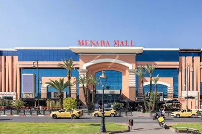 a mall with cars parked in front of it at Cosy appartement en plein cœur de Marrakech ! in Marrakech