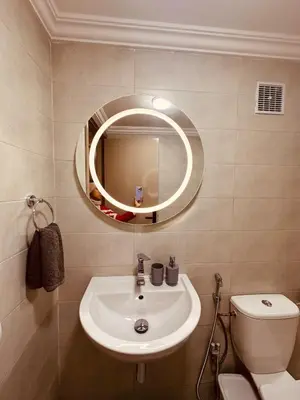 a bathroom with a sink and a mirror at Le cocon Majorelle in Marrakech