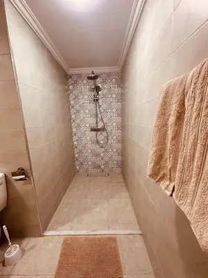 a bathroom with a shower with a tile shower at Le cocon Majorelle in Marrakech