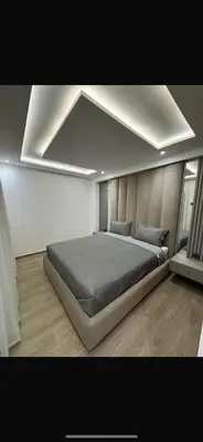 a bedroom with a large bed in a room at Modern marrakech duplex in Marrakech