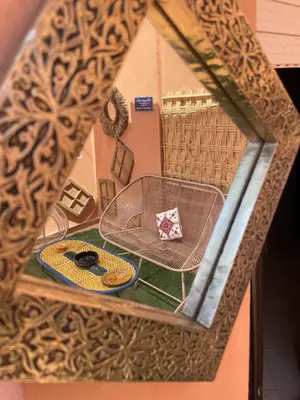 a view through a window of a room with a table at Appartement Nature et design in Marrakech