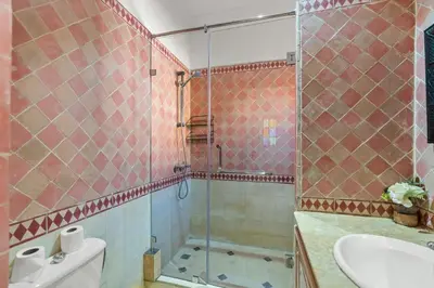 a bathroom with a shower and a toilet and a sink at Riad melyssa in Marrakech