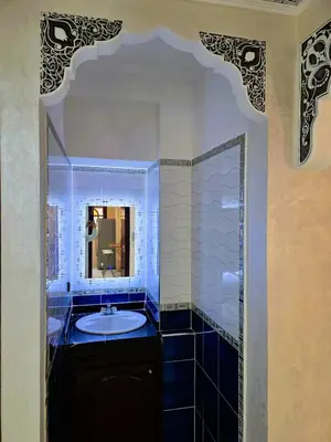 a bathroom with a sink and a mirror at Jonas House in Marrakech