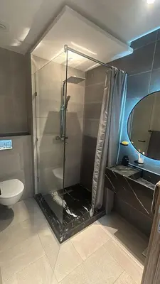 a bathroom with a shower with a sink and a toilet at High standing 2 minutes from Gueliz train station in Marrakech