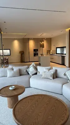 a living room with a white couch and a table at MIKESTAY - Villa Luma in Marrakech