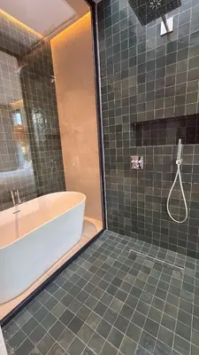 a bathroom with a tub and a sink and a shower at MIKESTAY - Villa Luma in Marrakech