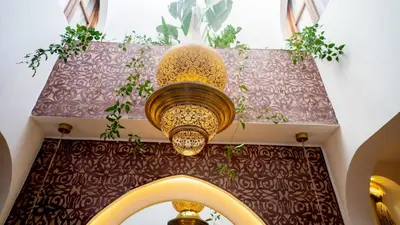 a chandelier with two lights hanging from a ceiling at Riad Lala Fatima - New & Exclusive - Pool & Breakfast in Marrakech