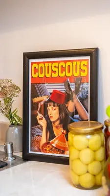 a picture of a movie in a frame on a counter at Riad Lala Fatima - New & Exclusive - Pool & Breakfast in Marrakech