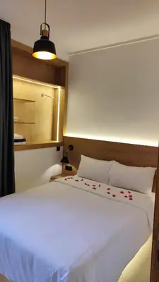 a bedroom with a large white bed in a room at Perle de Guéliz Marrakech in Marrakech