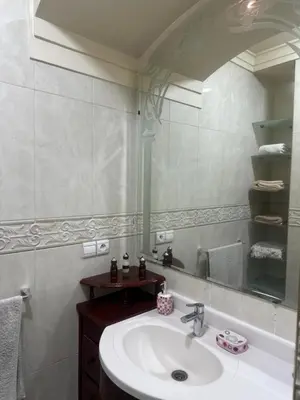 a bathroom with a sink and a mirror at مراكش كليز in Marrakech
