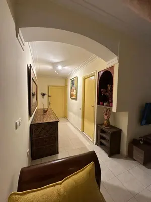 a living room with a couch and a table at مراكش كليز in Marrakech