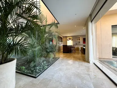 a living room with a large aquarium in a house at 4-Suite Villa, Private Pool at Jade Garden in El Rhechat