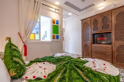 a bedroom with a christmas tree on a bed at Riad Dar Al Ghali in Marrakech