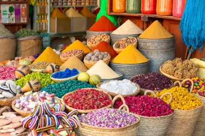 a display of different coloredumes in baskets in a market at Riad Dar Al Ghali in Marrakech