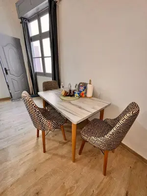 a table and two chairs in a room at Studio Mhamid 10 in Marrakech