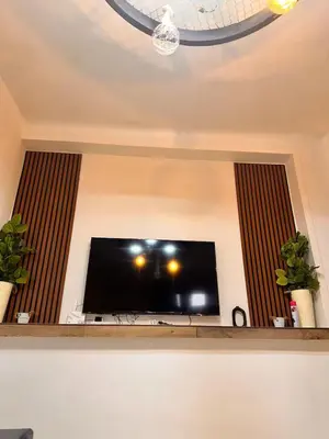 a flat screen tv sitting in a living room at Studio Mhamid 10 in Marrakech