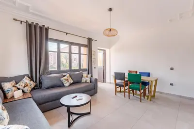 a living room with a couch and a table at Zou Appartement in Marrakech