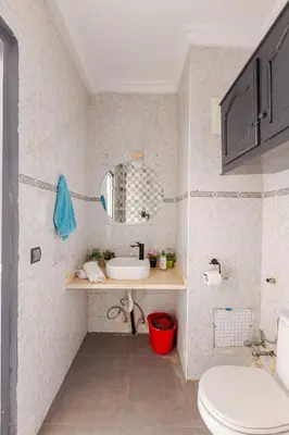 a bathroom with a sink and a toilet at Zou Appartement in Marrakech