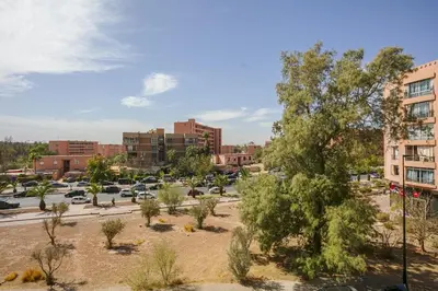 a view of a parking lot in a city at Appart chic et calme avec vue dégagée in Marrakech