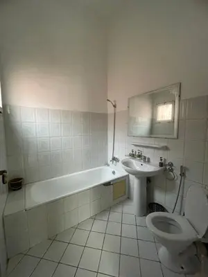 a bathroom with a tub and a toilet and a sink at Riad Zou Palm in Marrakech