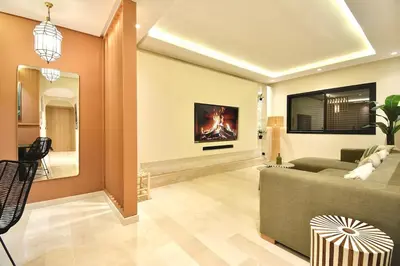 a living room with a couch and a fireplace at Le Petit Medina - 4prs - Wifi - Semlalia in Marrakech