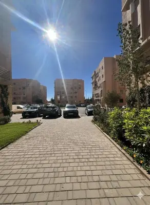a street with cars parked in a parking lot at RS 13 by KMREI Properties in Marrakech