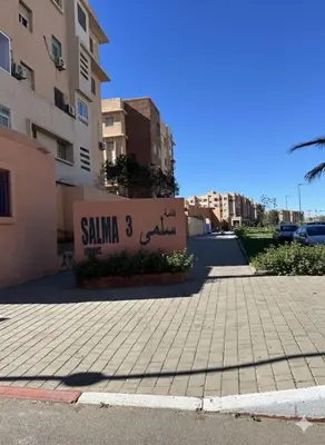 a sign on the side of a building at RS 13 by KMREI Properties in Marrakech