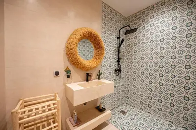 a bathroom with a sink and a shower at Riad Timitar in Marrakech