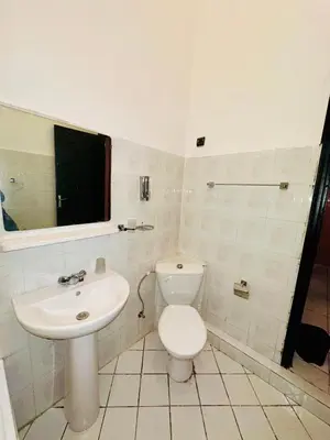 a bathroom with a white toilet and a sink at Lina Stay Riad Alkaria Assiyahia in Marrakech