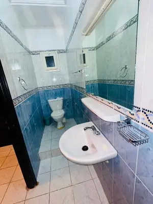 a bathroom with a sink and a toilet at Lina Stay Riad Alkaria Assiyahia in Marrakech