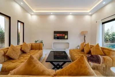 a living room with a couch and a tv at Domaine des lumières in Segraga