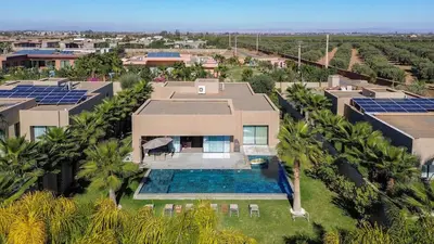 an aerial view of a house with a swimming pool at Syrine Villa with temperate pool, not overlooked in Marrakech