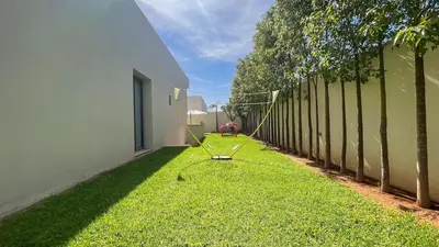 a yard with a baseball bat in the grass at Jade Villa with pool in Marrakesh in Marrakech