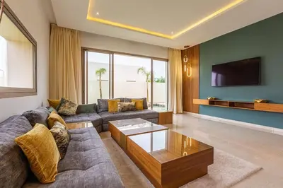a living room with a couch and a coffee table at Jade Villa with pool in Marrakesh in Marrakech