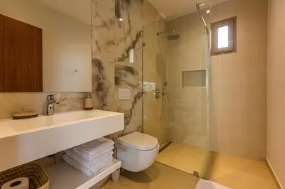a bathroom with a shower and a toilet and a sink at Jade Villa with pool in Marrakesh in Marrakech
