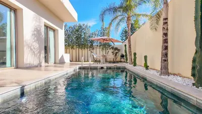 a swimming pool in the backyard of a house at Villa Amélia pool without opposite in Marrakech