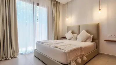 a bedroom with a bed with a large window at Beautiful Bahia villa with heated pool in Marrakesh in Marrakech