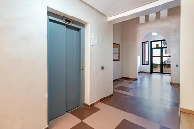 an empty hallway with a door in a building at Relaxing stay with pool & secure parking in Marrakech
