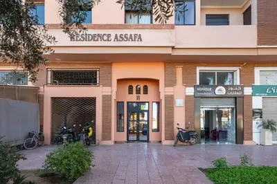 a building with motorcycles parked outside of it at Relaxing stay with pool & secure parking in Marrakech