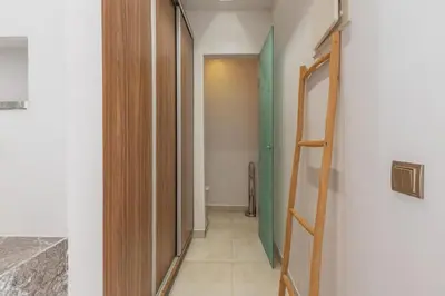 a hallway with a stairway leading to a bathroom at Aman Bungalow - heated pool, not overlooked in Marrakech