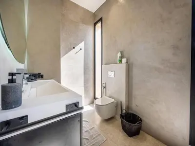 a bathroom with a sink and a toilet at Le Palais Zahira & Palais Mahora 2 villas in Marrakech