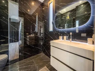 a bathroom with a sink and a toilet and a mirror at Le Palais Zahira & Palais Mahora 2 villas in Marrakech
