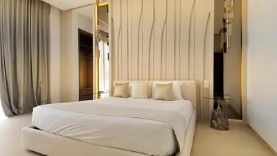 a large white bed in a room with a window at Villa Clea heated pool not overlooked in Marrakech