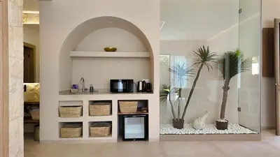 a kitchen with two palm trees in a room at Majorelle Bungalow - Heated pool, not overlooked in Marrakech