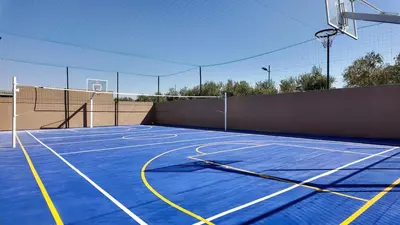 a basketball court with a net on top of it at Targa Bungalow - Heated pool, not overlooked in Marrakech
